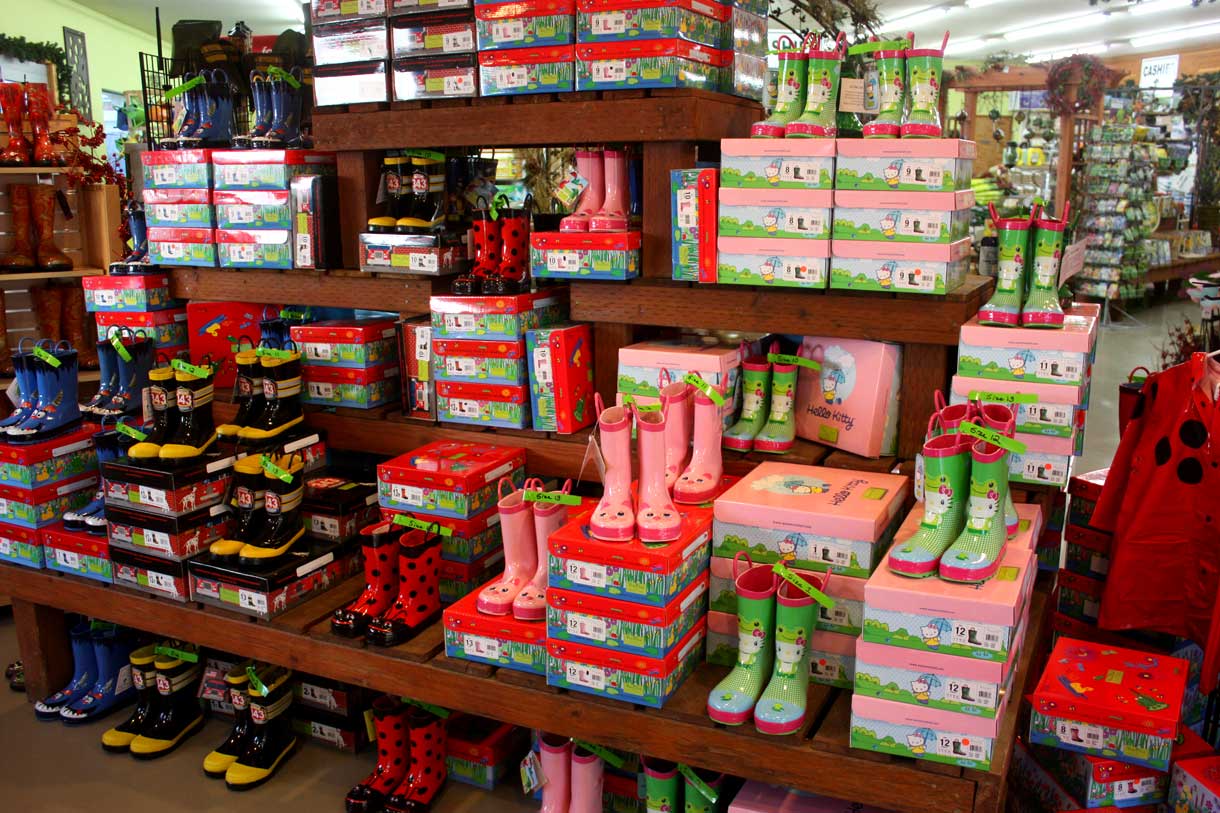 Colorful childrens' rain boots, just part of the great selection of hardgoods and other garden supplies at Bark & Garden Center.